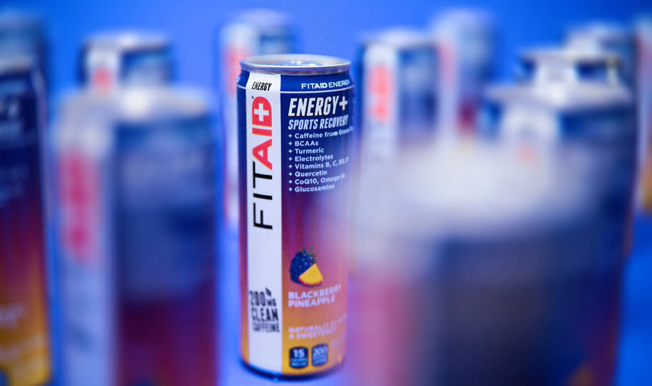 Several cans of FITAID Energy Blackberry Pineapple.