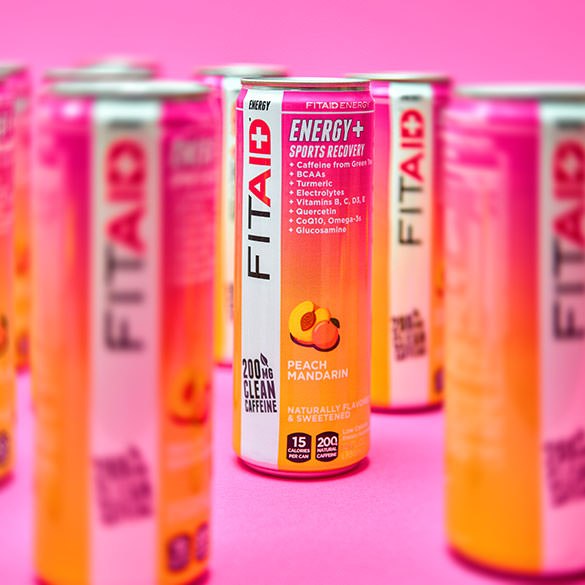 Several cans of FITAID Energy Peach Mandarin.