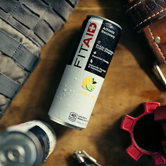 A can of FITAID with fitness equipments