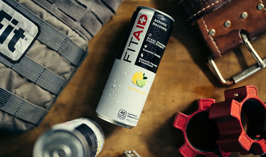 A can of FITAID with fitness equipments
