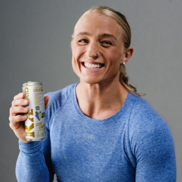 Kelsey Kiel drinking a can of FITAID RX Zero.