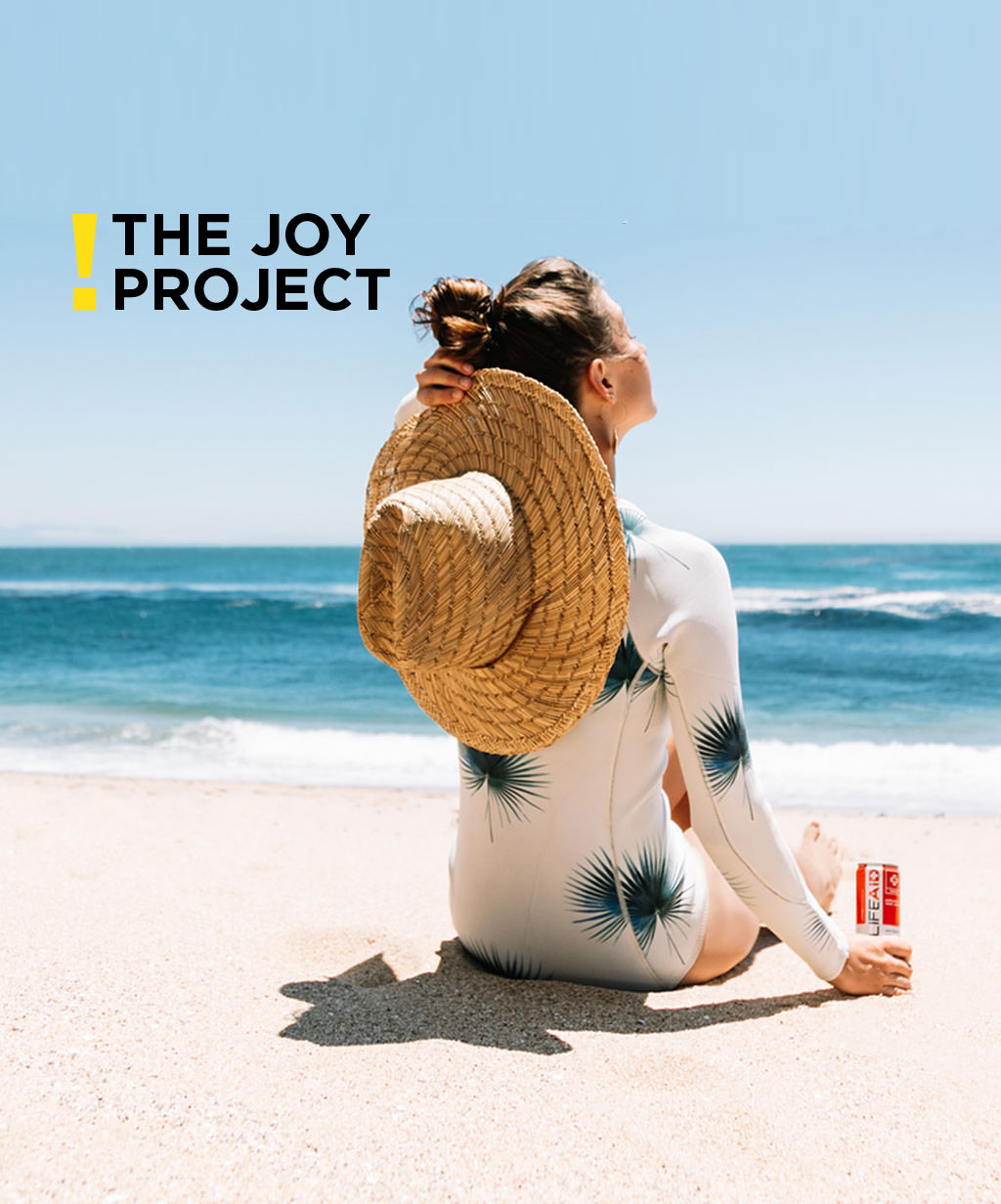 The Joy Project header image of girl on beach in the sunshine + logo